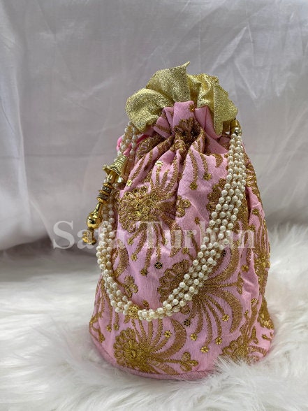 Multi Colour Potli Bag for women in Baby Pink colour with Golden Embroidery and Pearl Handle