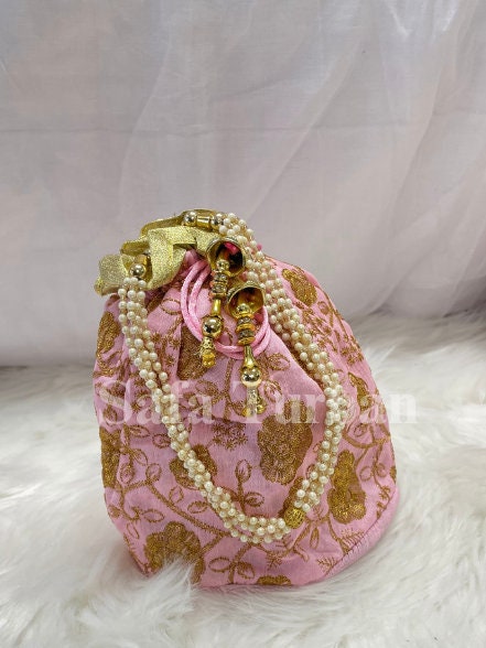 Multi Colour Potli Bag for women in Baby Pink colour with Golden Embroidery and Pearl Handle