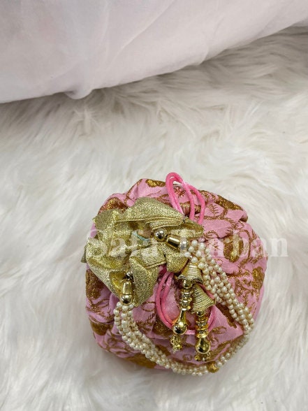 Multi Colour Potli Bag for women in Baby Pink colour with Golden Embroidery and Pearl Handle